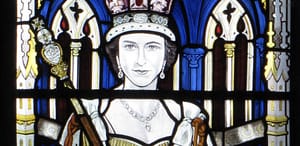 Queens image in coloured glass for From Princess to Queen Talk At Canterbury Cathedral. For Queen’s Platinum Jubilee Events In Kent