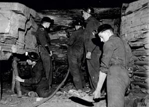 Bloack and white picture of miners working for the Kent Mining Museum at Betteshanger Country Park in Deal